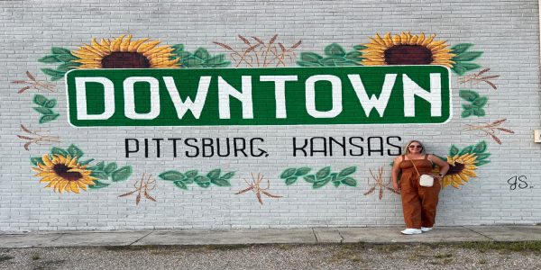Mural of downtown Pittsburg, Kansas with sunflowers